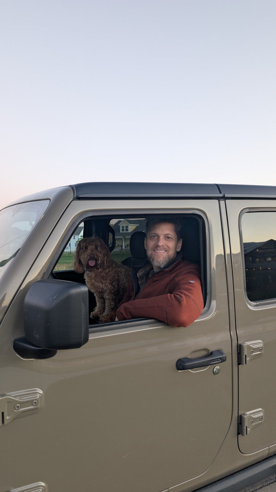 Ben Page’s dog leaning out of the Jeep window.